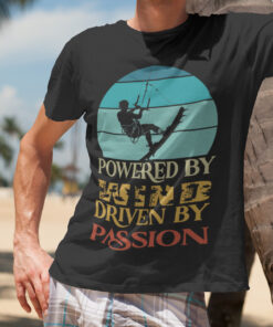 Powered by Wind: Premium Kite Surfing T-Shirt for Passionate Riders. A high-quality, adventure-inspired tee featuring a dynamic kite surfing design, perfect for ocean lovers and thrill-seekers