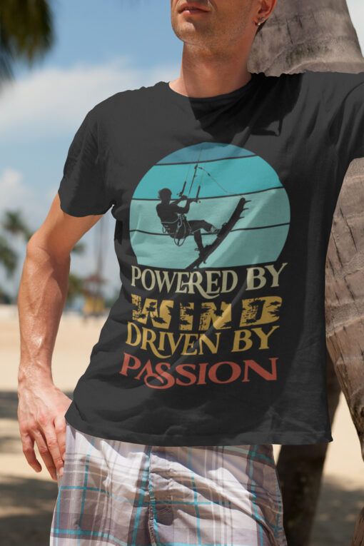 Powered by Wind: Premium Kite Surfing T-Shirt for Passionate Riders. A high-quality, adventure-inspired tee featuring a dynamic kite surfing design, perfect for ocean lovers and thrill-seekers