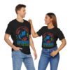 A couple wearing matching black diving t-shirts featuring the 'Harmony in the Depths' design, showcasing a dolphin, coral, and ocean-themed elements. Perfect for scuba divers and ocean lovers