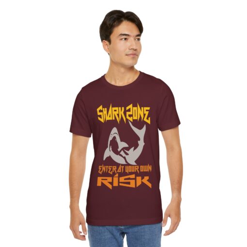 Shark Zone: Enter at Your Own Risk Diving T-Shirt – A bold maroon t-shirt featuring a fierce shark graphic and edgy text design. Perfect for ocean lovers and thrill-seeking divers