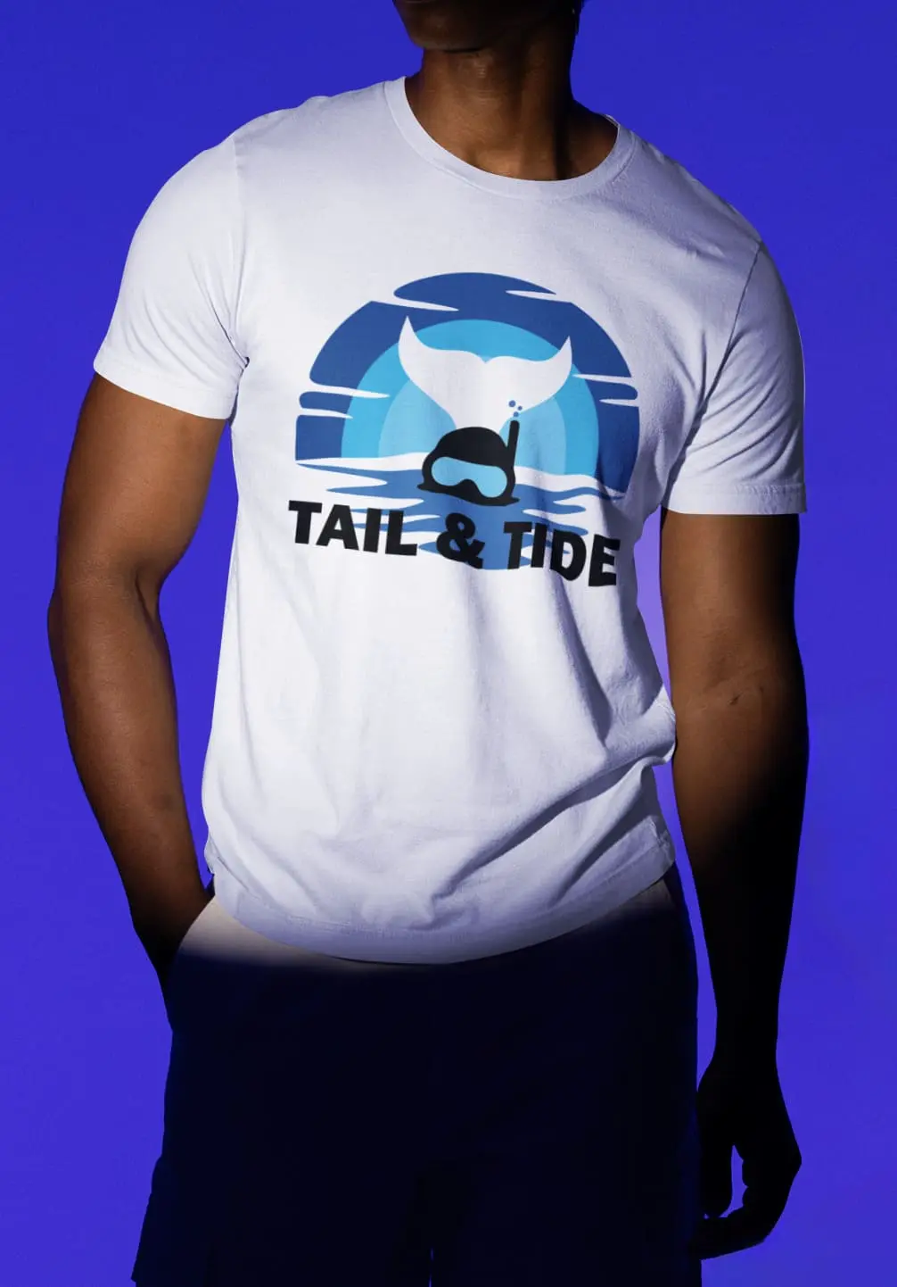 Tide & Tales Diving TShirt with blue whale tail and snorkel mask design on ocean wave background