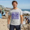 Man wearing the Blue Matters ocean conservation T-shirt during a beach cleanup event, promoting plastic-free oceans and marine life protection.