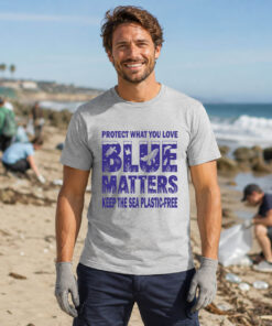Man wearing the Blue Matters ocean conservation T-shirt during a beach cleanup event, promoting plastic-free oceans and marine life protection.