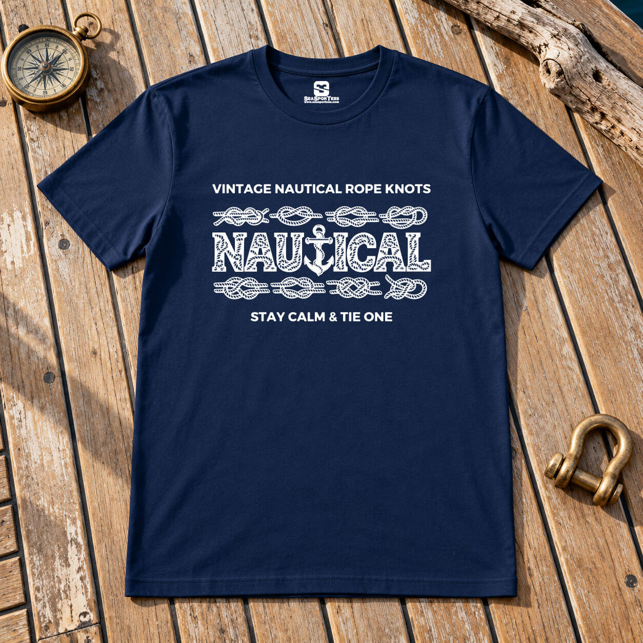 Navy Seasportees nautical knot t-shirt with white rope-textured NAUTICAL anchor lettering on a weathered wooden deck